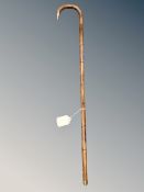 An antique child's bamboo walking cane,