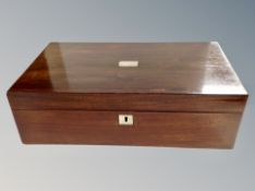 A Victorian rosewood writing slope with purple velvet lined interior