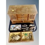 A wooden jewellery chest and contents, pearls, costume jewellery, lady's and gent's watches,