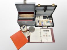 A briefcase and file box containing several stamp albums,