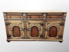 A good quality oak and burr walnut sideboard, probably by Titchmarsh and Goodwin,