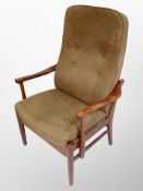 A contemporary Danish stained beech framed armchair in cinnamon upholstery,