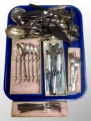 A large quantity of boxed and unboxed silver plated flat ware