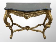 A period-style gilt console table with black granite top,