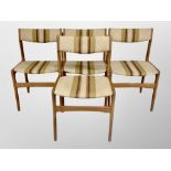 A set of four Erik Buch designed teak framed dining chairs in striped upholstery