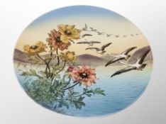 A Villeroy & Boch charger depicting geese in flight,