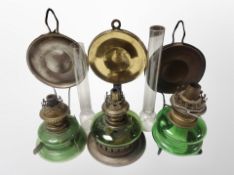 Three glass and brass oil lamps