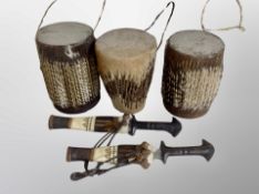 Three animal hide drums,
