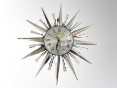 A quartz sunburst wall clock