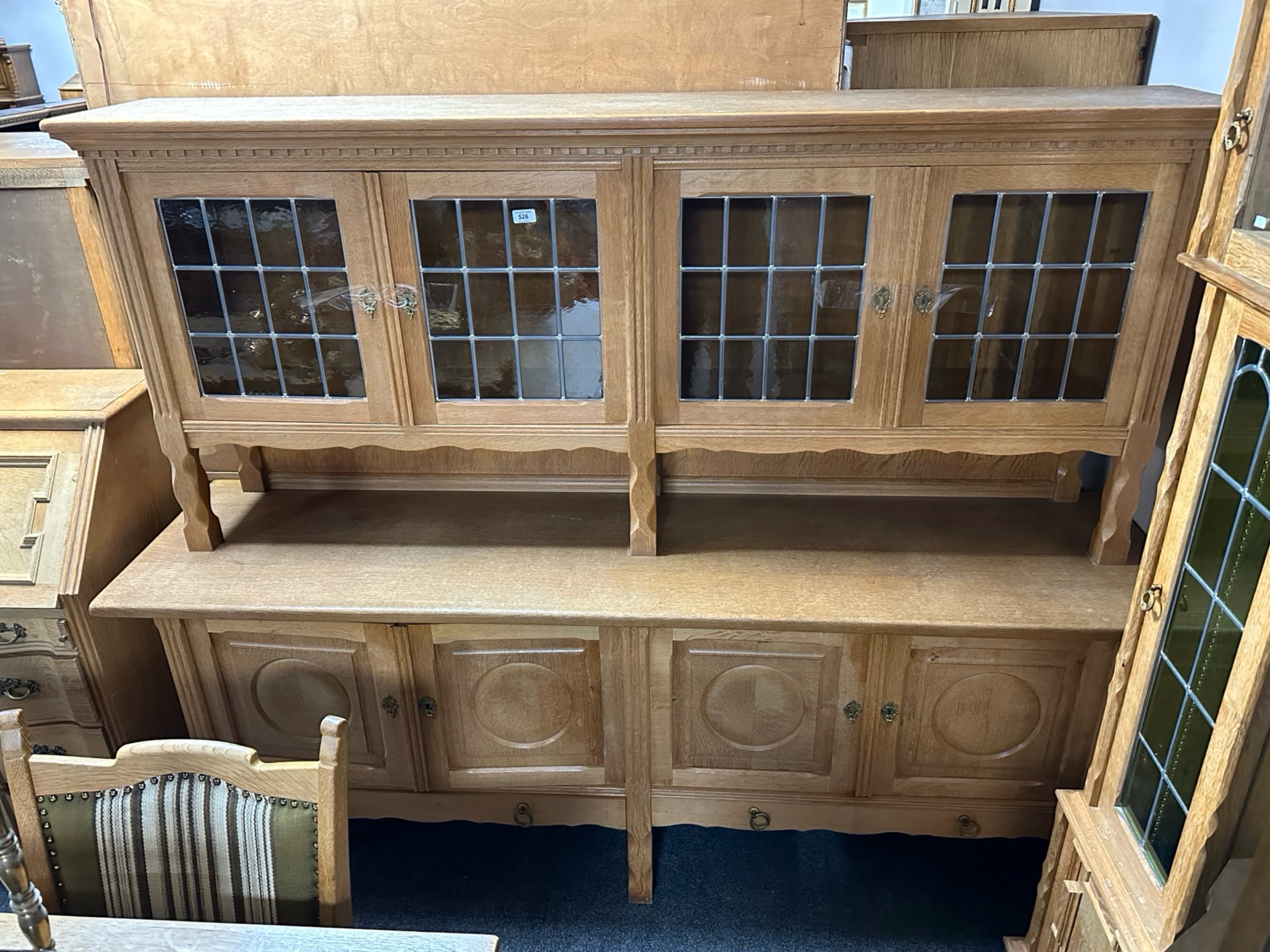 A Danish blond oak and leaded glass door four door sideboard,