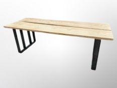 An industrial-style pine and steel table,