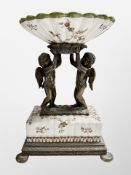 A 19th century patinated metal and crackle glazed porcelain centre piece,