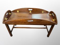 A mahogany brass mounted butler's tray table,