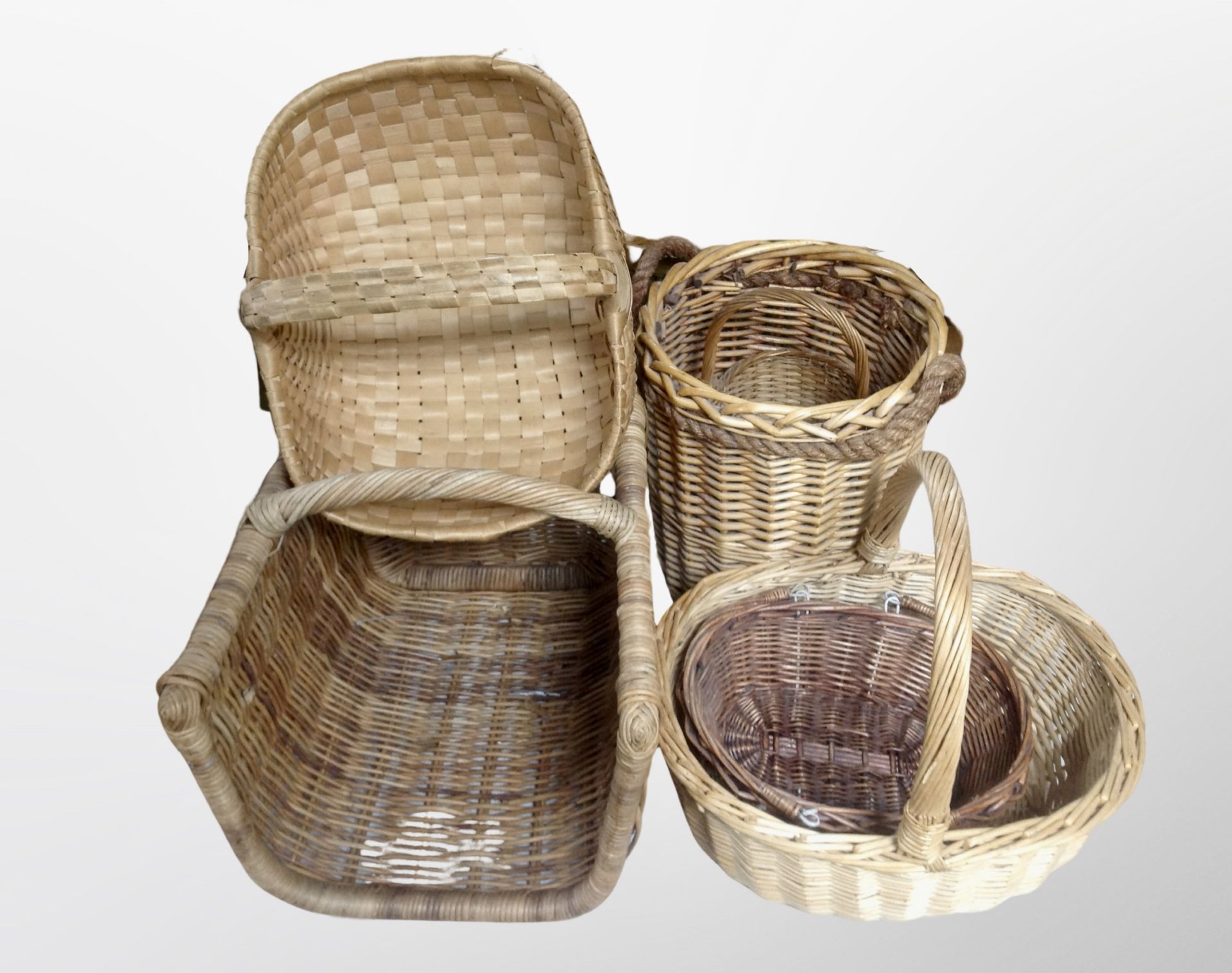 A group of six wicker baskets
