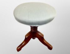 A turned beech tripod stool,