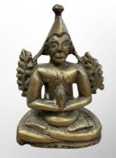 A 19th century Tibetan brass devotional statue, height 12cm.