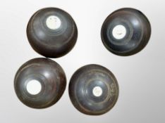 A set of four vintage turned wooden Boules