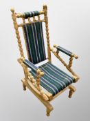 A 20th century Danish oak bobbin turned rocking chair