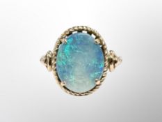 A 14ct yellow gold opal doublet ring, size N.