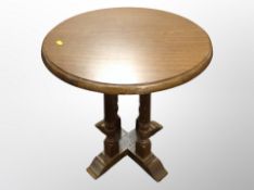 An oak circular occasional table diameter 57 cm