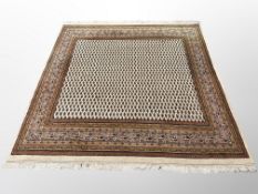 A Tabriz-design square carpet on cream ground 208 cm x 200 cm
