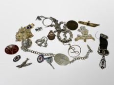 A silver bracelet (possibly of WWI interest) engraved 'St Quentin 151', military badges,