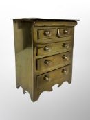 A miniature brass chest of five drawers,