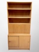 A 1970's Danish teak sliding door wall unit,