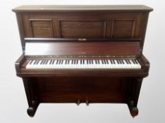 A Kemble mahogany cased overstrung upright piano,