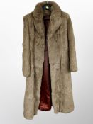 A lady's 3/4 length rabbit fur coat,