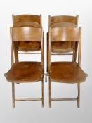 A set of four Scandinavian beech folding chairs