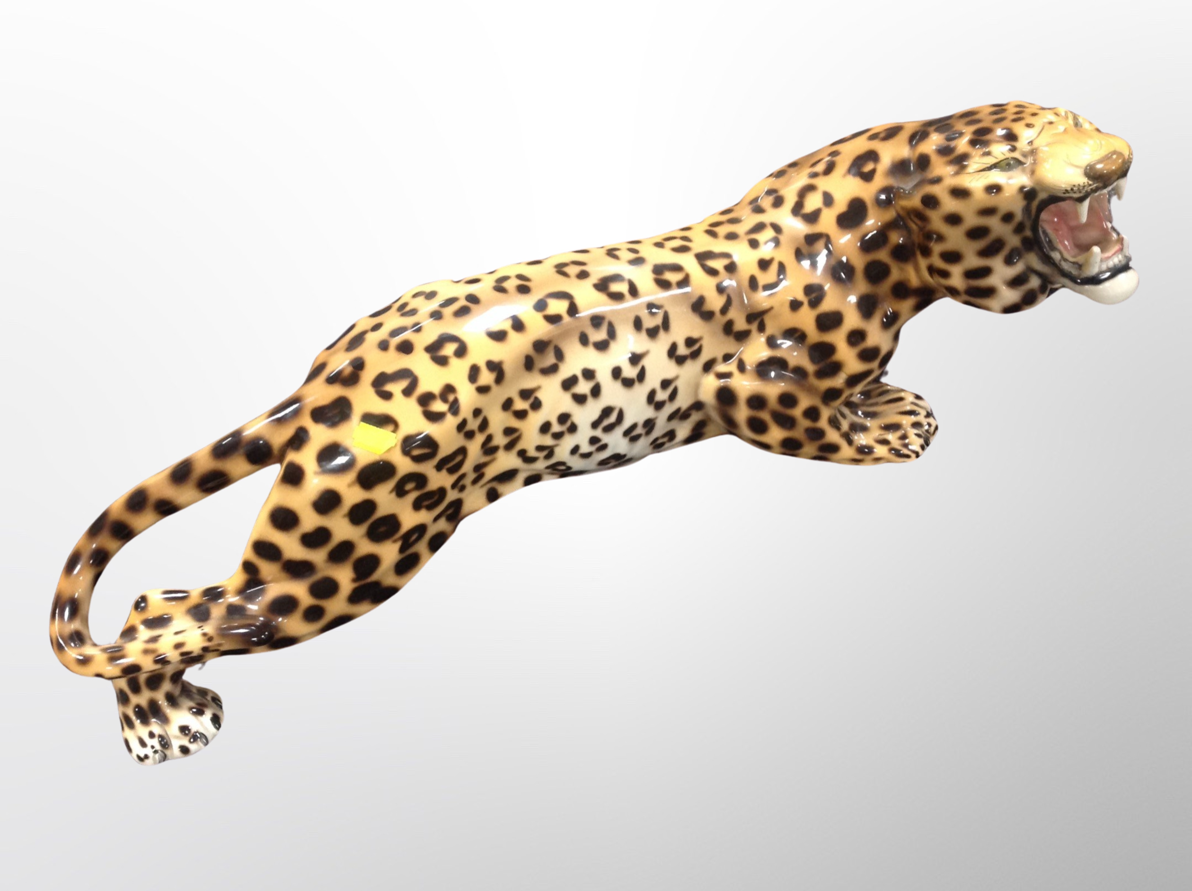 A ceramic figure of a cheetah,