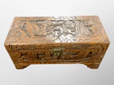 An Oriental carved camphor wood chest,
