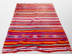 A striped flat weave throw