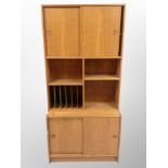 A 1970's Danish teak sliding door wall unit,