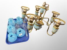 A Scandinavian gilt brass and ceramic five branch chandelier with blue glass shades and chimneys,