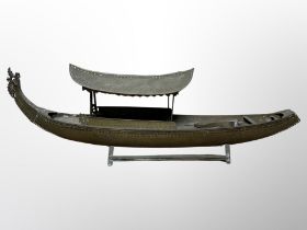 A brass model of a junk boat,