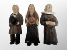 Three Continental carved wooden figures,