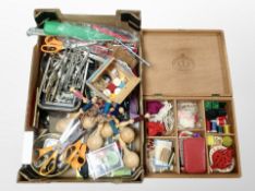 A box of Danish teak sewing box and contents, bobbin stands, related tools,