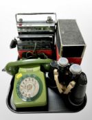 A vintage plastic telephone, a pair of Vespa 10 x 50 binoculars,