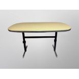 A 1970's chrome and melamine oval dining table,