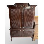 A late 20th century continental mahogany double door cabinet,