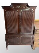 A late 20th century continental mahogany double door cabinet,