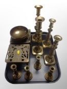 Two pairs of brass candlesticks, further set of four candlesticks,