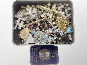 A group of crucifixes and crosses, some silver,