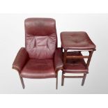 A 1970's Danish stained beech framed armchair in Burgundy leather upholstery together with two