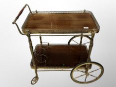 A 20th century teak and brass serving trolley,