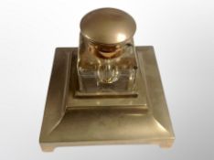A brass and crystal inkwell,