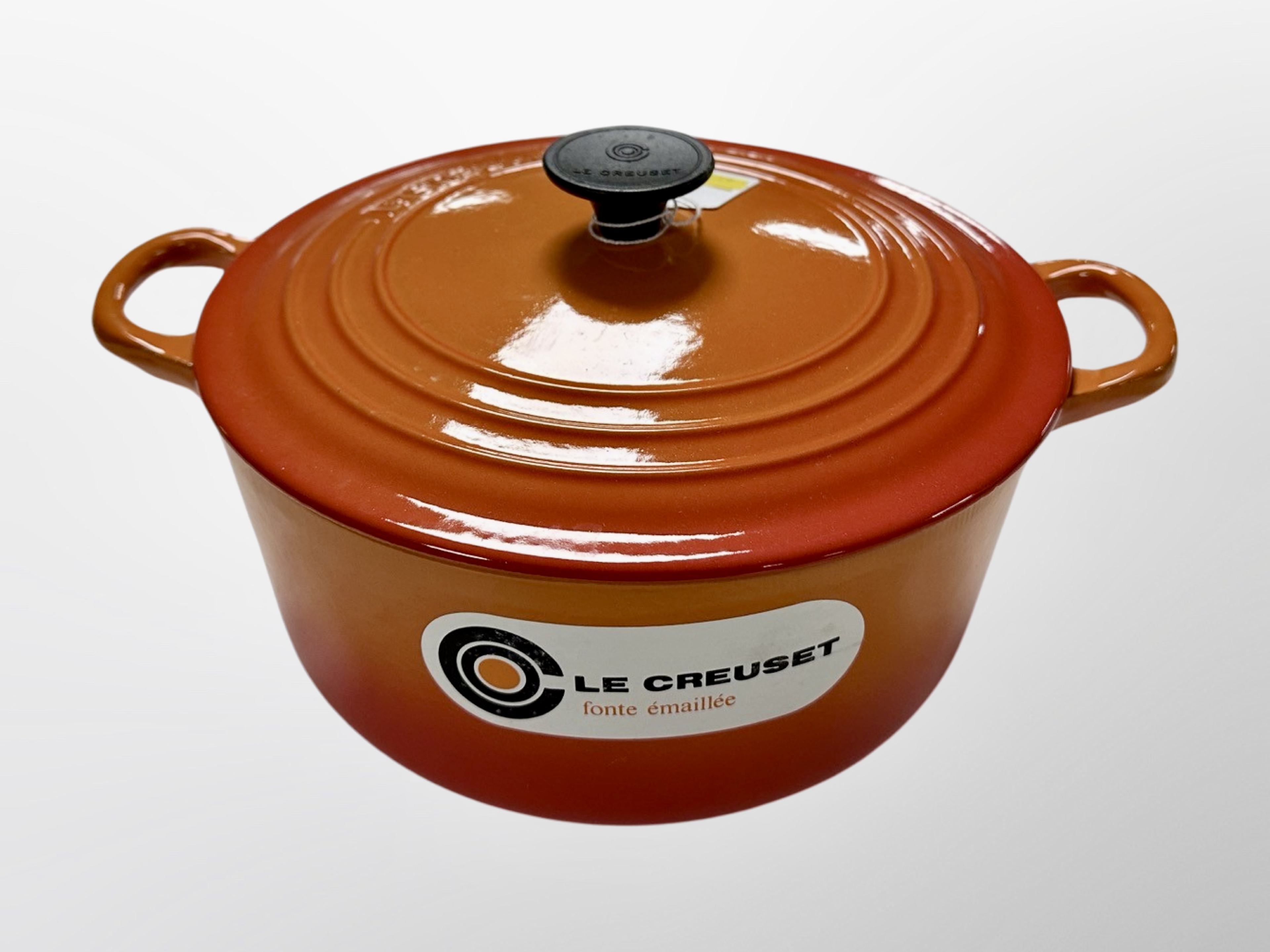 A Le Creuset twin handled cooking pot,