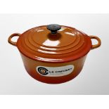 A Le Creuset twin handled cooking pot,